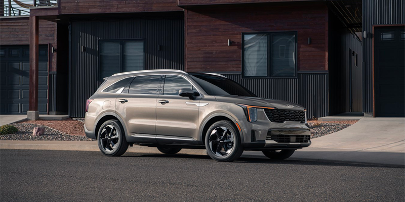 2025 kia sorento parked in front of a house